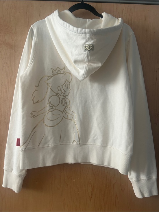 Nintendo Sweaters - Nintendo Cream Hoodie with Gold Princess Peach Outline